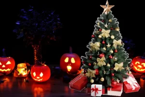 carved jack'o'lanterns sitting next to a christmas tree with presents underneath